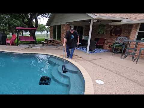 how to clean pool steps with a cordless vacuum: Aiper Pilot X1 handheld cordless pool vacuum shown during my hands-on review