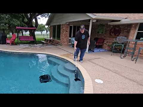 how to clean pool steps with a cordless vacuum: Aiper Pilot X1 handheld cordless pool vacuum shown during my hands-on review